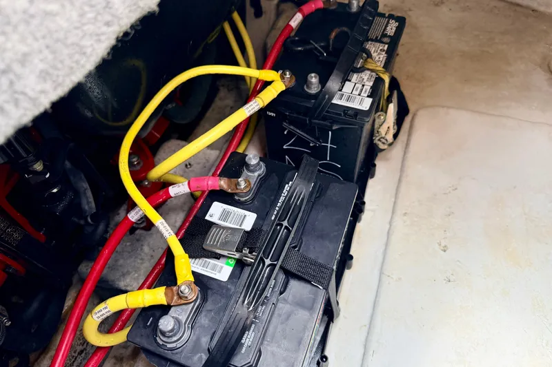 Slide: The Image of Batteries and wiring in a 2015 Chaparral Sunesta 264 boat. - 33