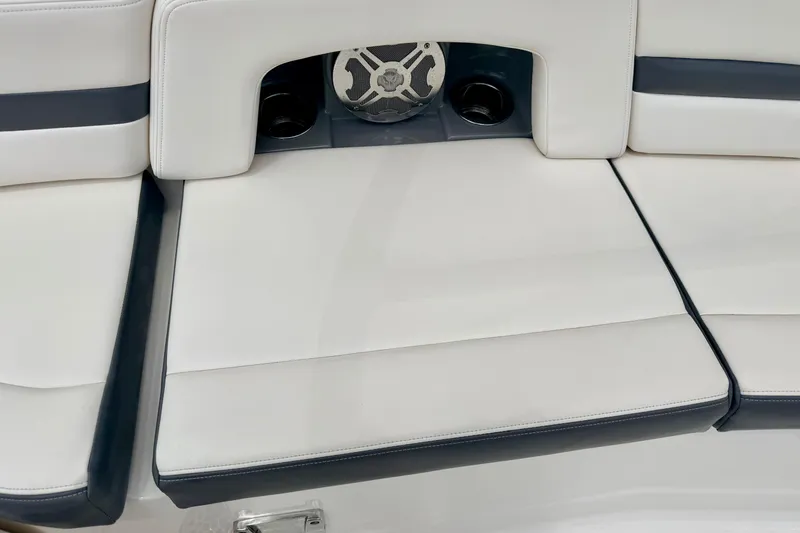 Slide: The Image of 2015 Chaparral Sunesta 264 boat seating with integrated speaker and cup holders. - 34