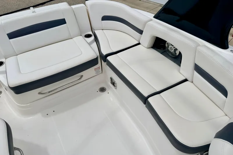 Slide: The Image of 2015 Chaparral Sunesta 264 boat interior with white and gray seating. - 38