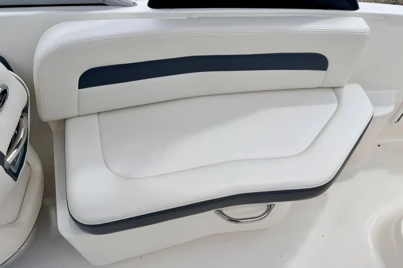 Slide: The Image of 2015 Chaparral Sunesta 264 boat seat with white and navy upholstery. - 39