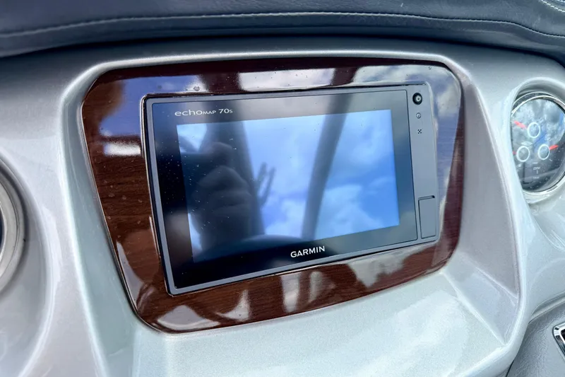 Slide: The Image of Garmin EchoMap 70s on 2015 Chaparral Sunesta 264 dashboard, reflecting sky. - 43