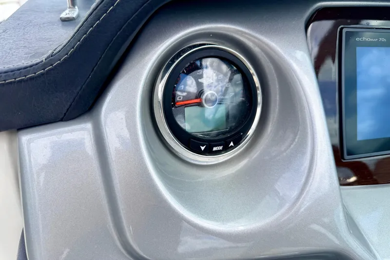 Slide: The Image of Dashboard of 2015 Chaparral Sunesta 264 boat with gauge and display screen. - 44
