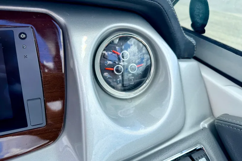 Slide: The Image of Dashboard of a 2015 Chaparral Sunesta 264 boat with gauge and controls. - 45