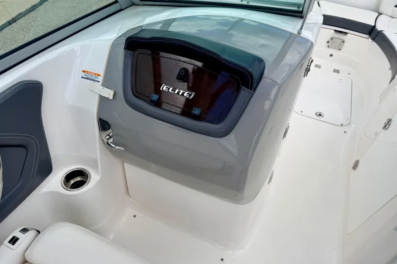 Slide: The Image of 2015 Chaparral Sunesta 264 boat interior with Elite dashboard and seating area. - 56