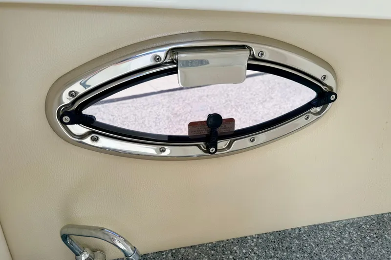 Slide: The Image of Oval window on 2015 Chaparral Sunesta 264 boat interior. - 58