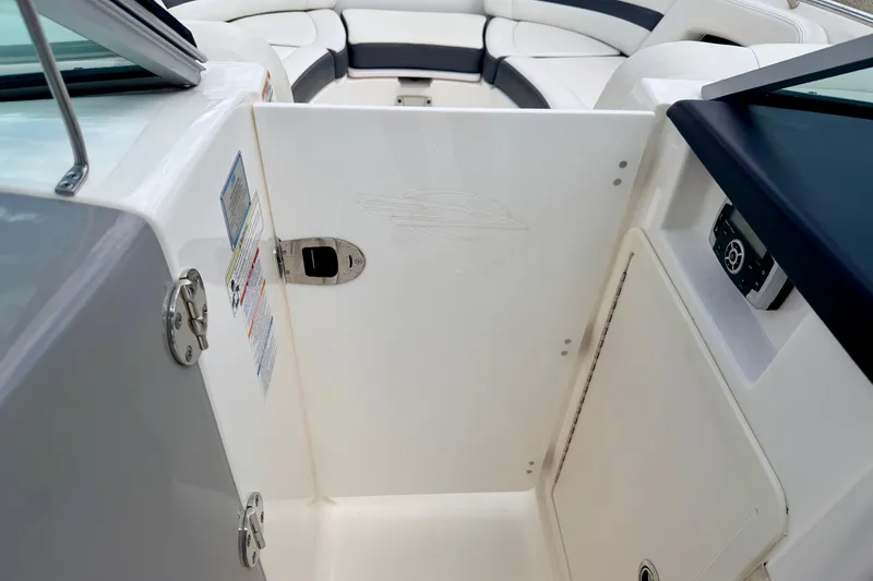 Slide: The Image of 2015 Chaparral Sunesta 264 boat interior with seating and control panel. - 62