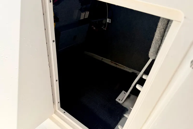 Slide: The Image of 2015 Chaparral Sunesta 264 interior cabin entrance with visible steps. - 64