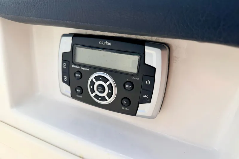 Slide: The Image of Clarion audio system in 2015 Chaparral Sunesta 264 boat dashboard. - 66