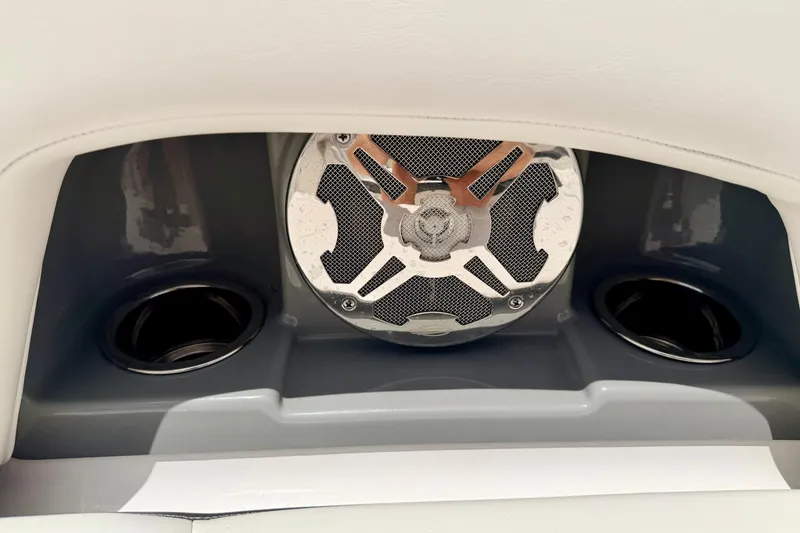 Slide: The Image of Speaker and cup holders on 2015 Chaparral Sunesta 264 boat interior. - 71