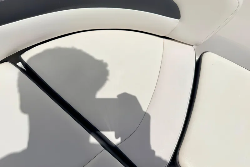 Slide: The Image of Shadow on white seating of 2015 Chaparral Sunesta 264 boat interior. - 72