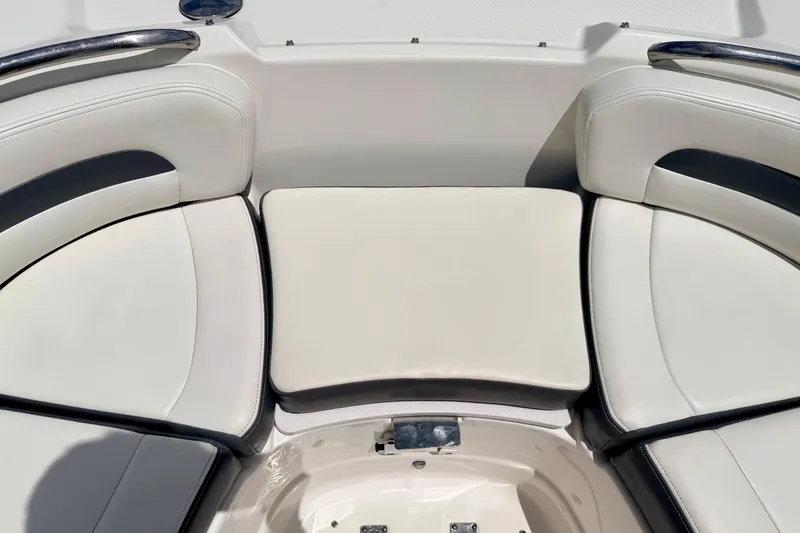 Slide: The Image of 2015 Chaparral Sunesta 264 boat interior with white cushioned seating. - 73
