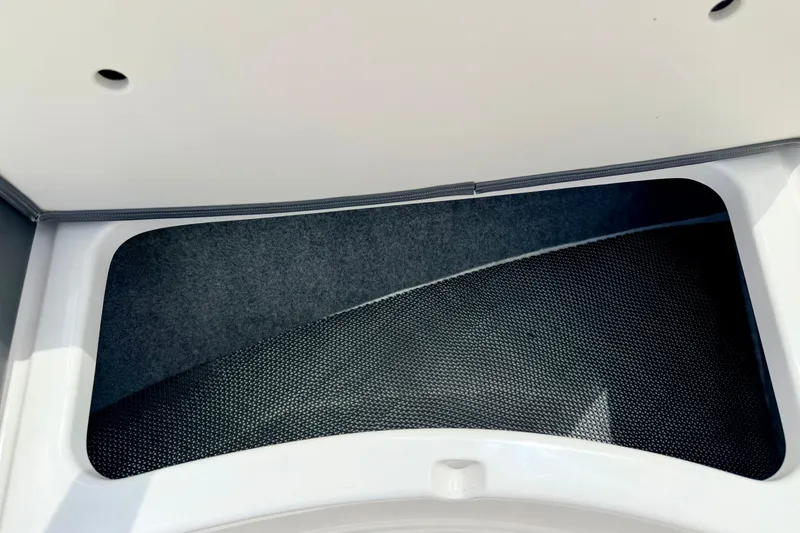 Slide: The Image of Storage compartment in 2015 Chaparral Sunesta 264 boat, featuring sleek interior design. - 77
