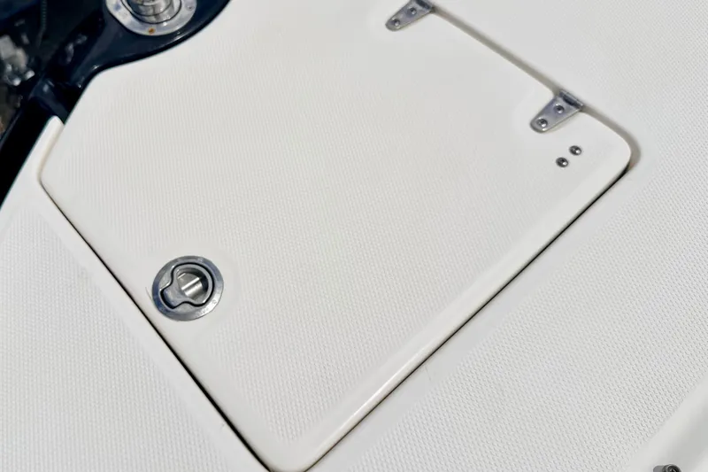 Slide: The Image of 2015 Chaparral Sunesta 264 boat deck with textured surface and metal fittings. - 83
