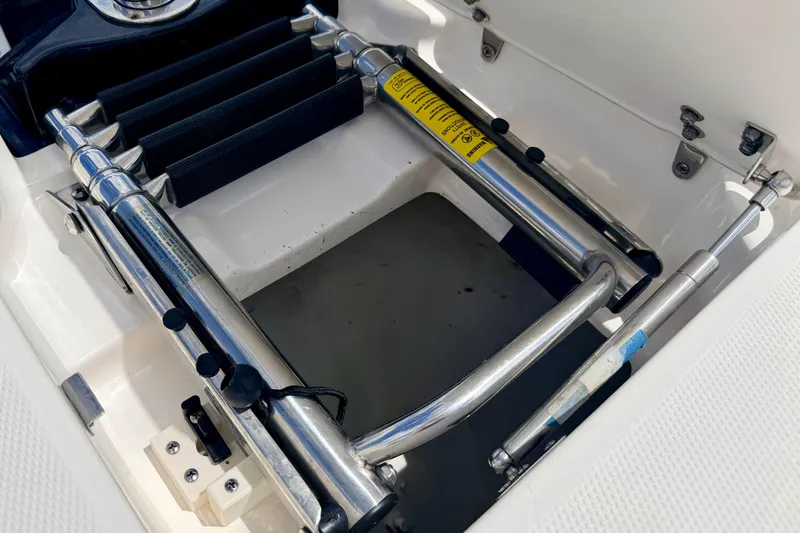 Slide: The Image of Stainless steel ladder on 2015 Chaparral Sunesta 264 boat, folded and secured. - 84