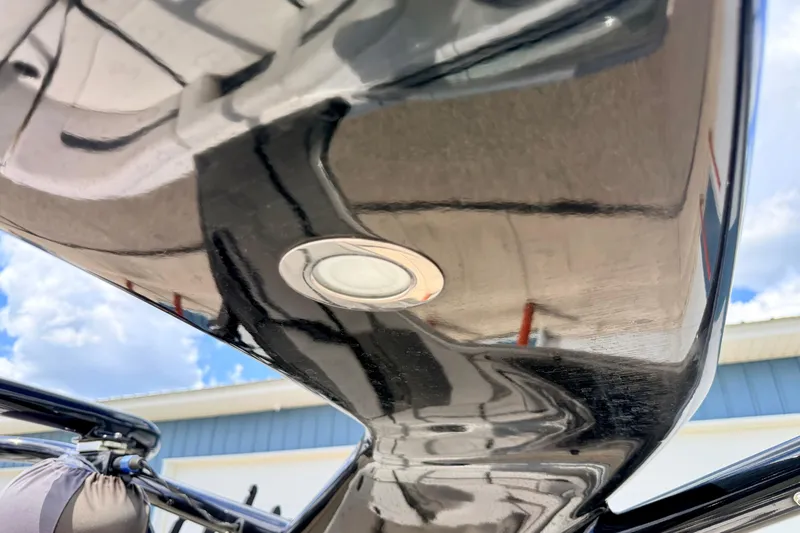 Slide: The Image of Close-up of a 2015 Chaparral Sunesta 264 boat hull with sleek, reflective finish. - 91