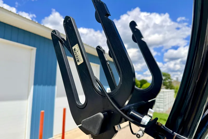 Slide: The Image of Close-up of a 2015 Chaparral Sunesta 264 boat accessory against a blue sky background. - 98