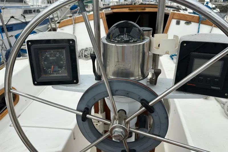 Slide: The Image of Steering wheel and instruments on a 1985 Catalina 36 sailboat cockpit. - 31