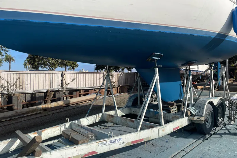 Slide: The Image of 1985 Catalina 36 sailboat on trailer, ready for transport or maintenance. - 37