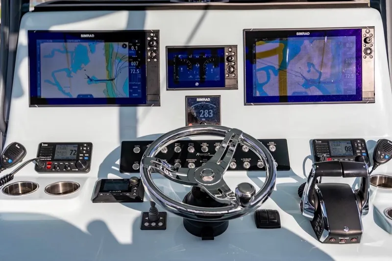 Slide: The Image of 2024 Front Runner 36 Center Console dashboard with navigation screens and controls. - 8