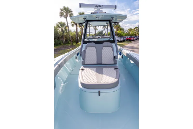 Slide: The Image of 2024 Front Runner 36 Center Console boat with cushioned seating and sleek design. - 9