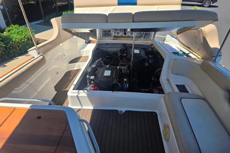Slide: The Image of 2002 Chris-Craft Launch 28 GT I/O boat engine compartment with open hatch. - 18