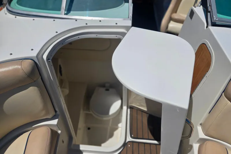 Slide: The Image of Interior view of 2002 Chris-Craft Launch 28 GT I/O boat with seating and compact restroom. - 25