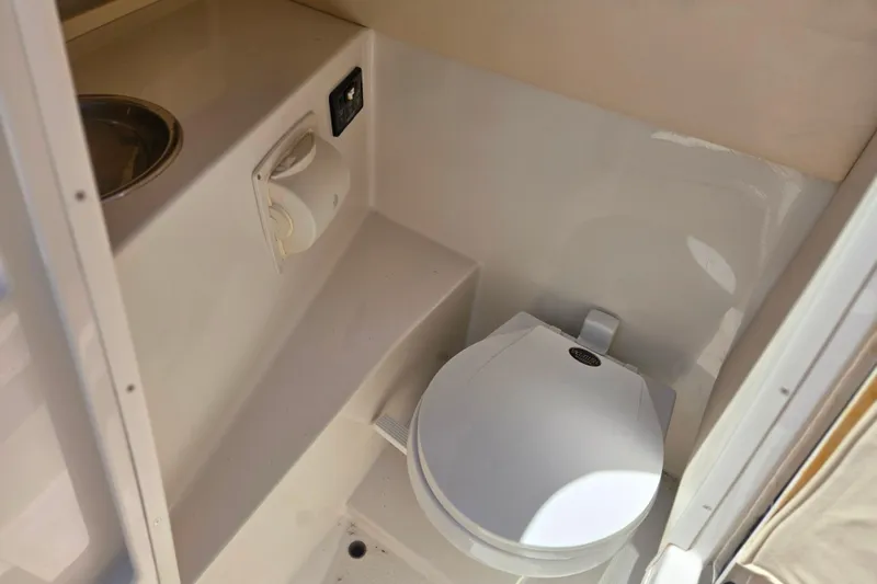 Slide: The Image of Compact marine toilet in 2002 Chris-Craft Launch 28 GT I/O boat interior. - 26