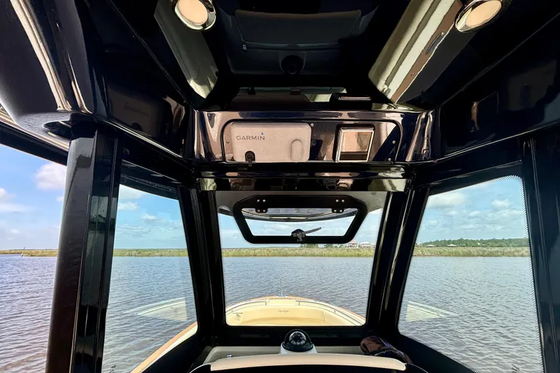Slide: The Image of Interior view of 2020 Chris-Craft Catalina 27 boat with Garmin navigation system. - 26