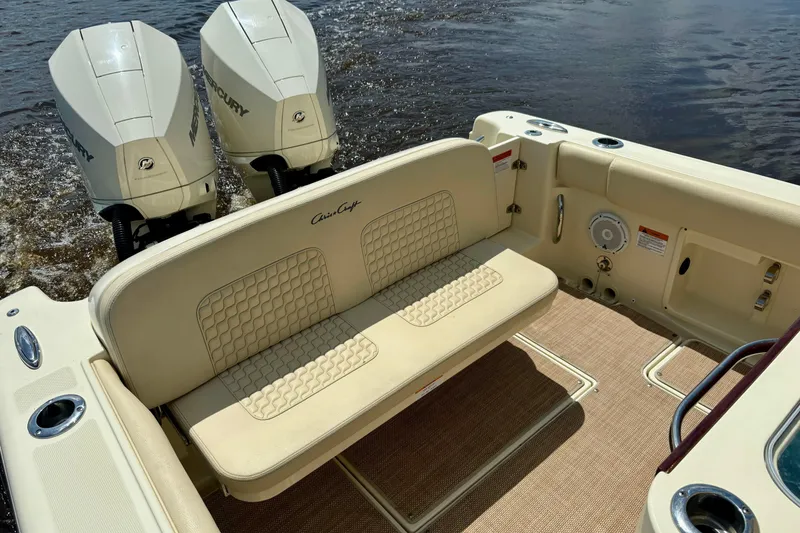 Slide: The Image of 2020 Chris-Craft Catalina 27 boat interior with dual Mercury engines and cushioned seating. - 35