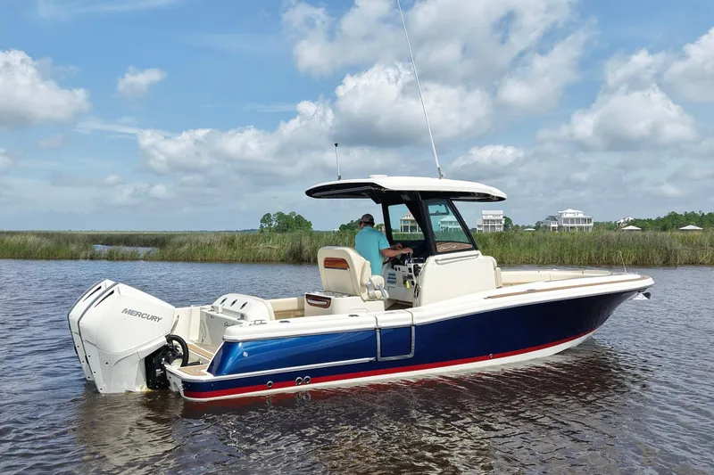 Slide: The Image of 2020 Chris-Craft Catalina 27 boat on water, featuring Mercury outboard engine. - 5