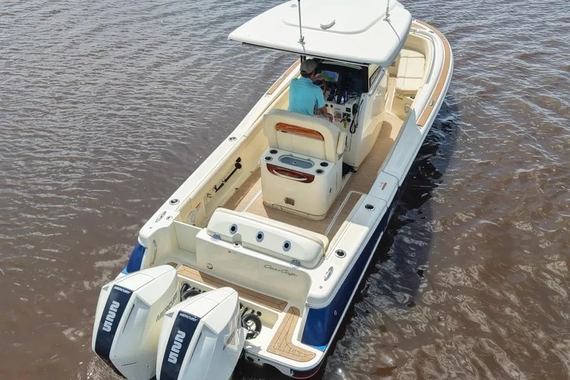 Slide: The Image of 2020 Chris-Craft Catalina 27 boat on water, featuring dual Mercury engines. - 7