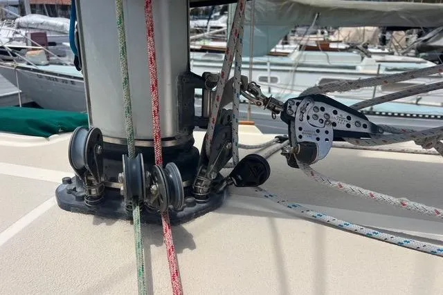 Slide: The Image of Sailing rigging on a 1991 Caliber 33 yacht, featuring ropes and pulleys. - 16
