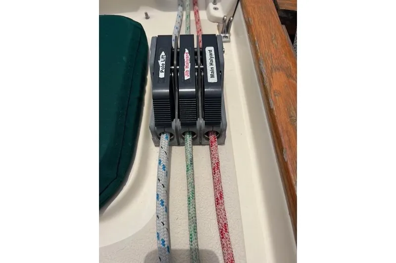 Slide: The Image of Sailing ropes and clutches on a 1991 Caliber 33 boat deck. - 18