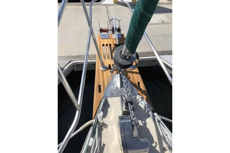 Slide: The Image of Bow of 1991 Caliber 33 sailboat with anchor chain and deck fittings. - 27