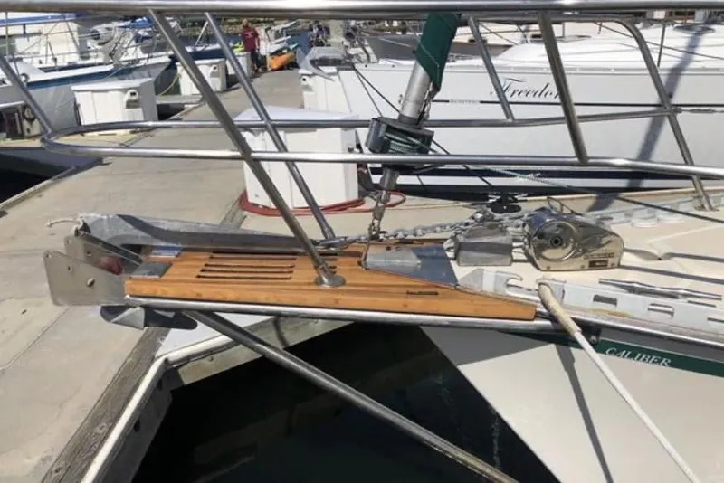 Slide: The Image of Bow of a 1991 Caliber 33 sailboat with anchor and deck details. - 28