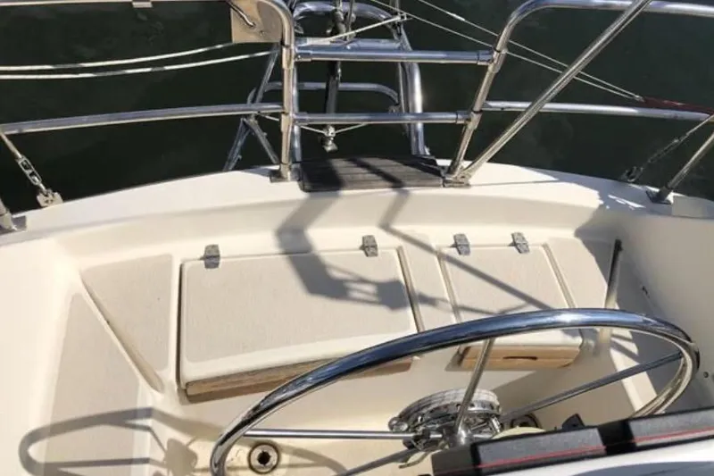 Slide: The Image of Sailboat cockpit of a 1991 Caliber 33 with steering wheel and deck view. - 32