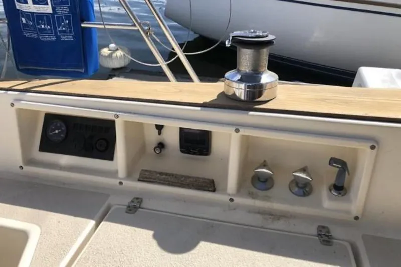 Slide: The Image of Control panel of a 1991 Caliber 33 sailboat with gauges and winch. - 34