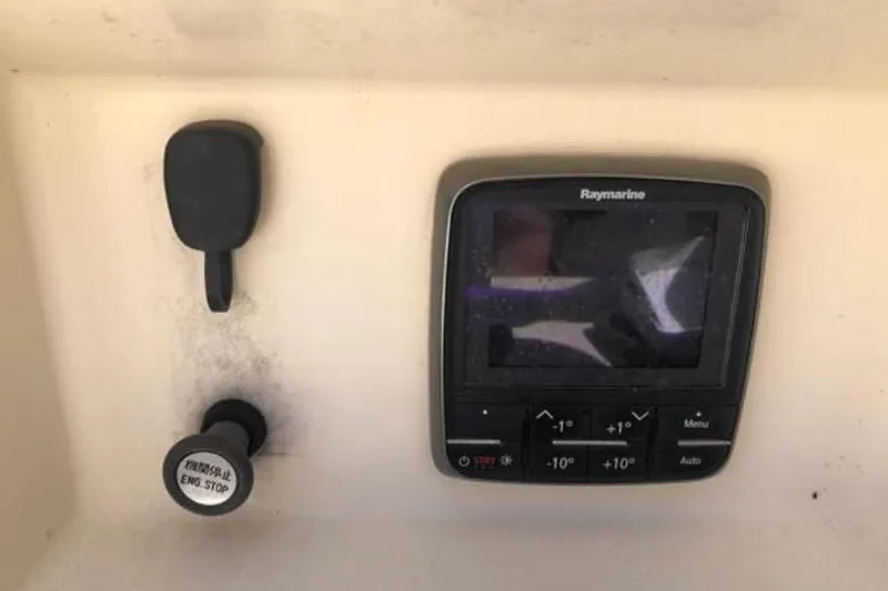 Slide: The Image of Control panel of a 1991 Caliber 33 boat with Raymarine display. - 41