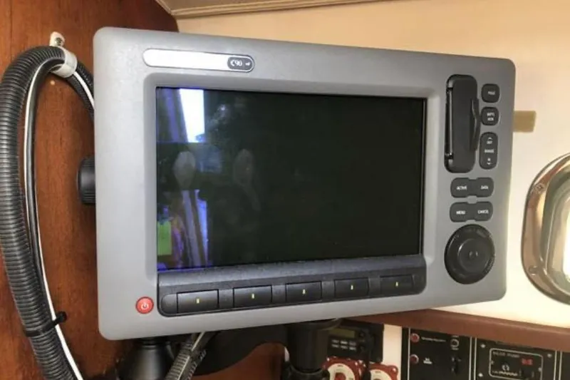 Slide: The Image of Navigation system on a 1991 Caliber 33 sailboat, featuring a control panel and display. - 62