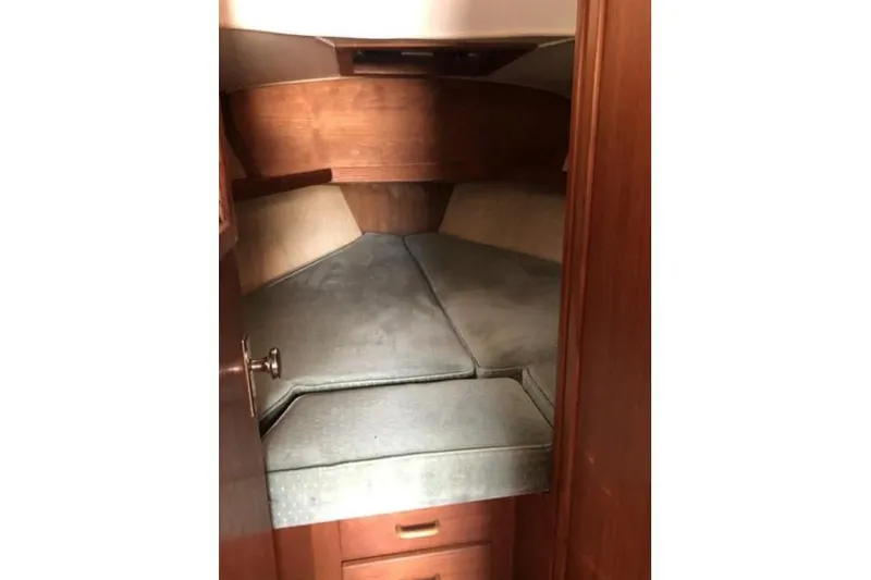 Slide: The Image of Interior cabin of 1991 Caliber 33 sailboat with cushioned sleeping area. - 63