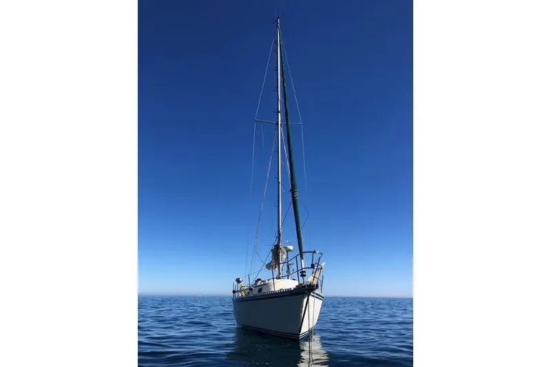 Slide: The Image of Sailboat on calm sea, 1991 Caliber 33, under clear blue sky. - 7