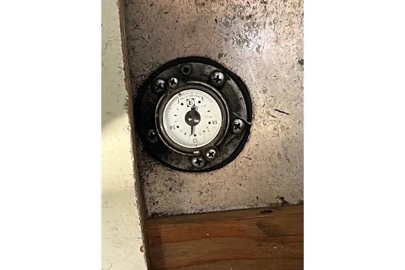 Slide: The Image of Old Caliber 33 gauge on a metal panel, showing wear and age. - 70