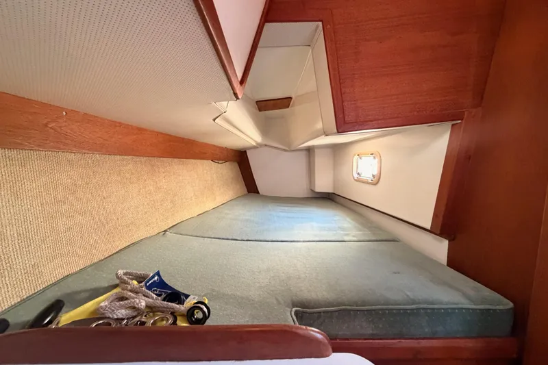 Slide: The Image of Interior cabin of a 1991 Caliber 33 sailboat with a cozy sleeping area. - 55