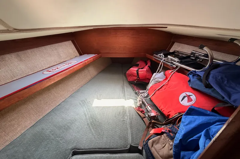 Slide: The Image of Interior cabin of a 1991 Caliber 33 sailboat with storage and equipment. - 44