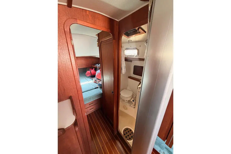 Slide: The Image of Interior of 1991 Caliber 33 sailboat showing cabin and compact bathroom. - 41