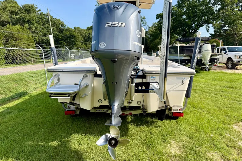 Slide: The Image of 2009 Pathfinder 2200 Tournament Edition boat with Yamaha 250 engine on grassy area. - 4