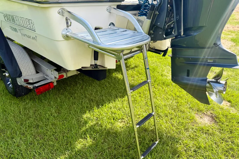 Slide: The Image of Rear view of 2009 Pathfinder 2200 Tournament Edition boat with ladder and motor. - 5