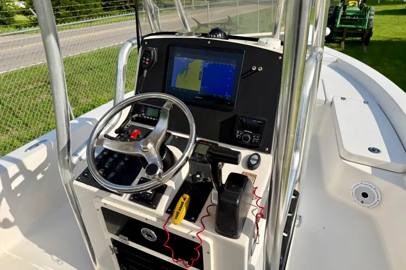 Slide: The Image of 2009 Pathfinder 2200 Tournament Edition boat console with steering wheel and navigation display. - 8