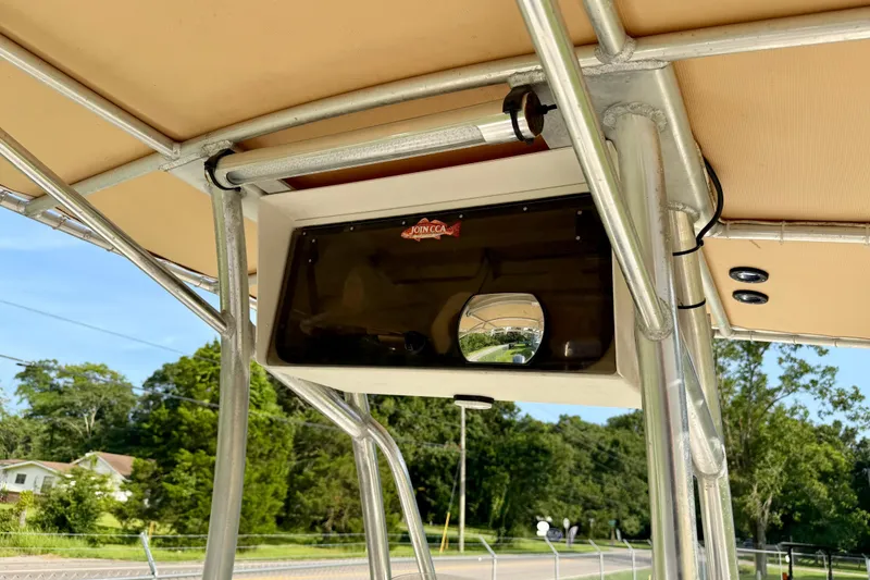 Slide: The Image of 2009 Pathfinder 2200 Tournament Edition boat T-top with storage compartment and mirror. - 9