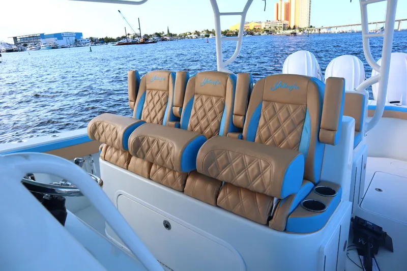 Slide: The Image of Luxurious seating on 2022 Yellowfin 42 Offshore boat with scenic waterfront view. - 48